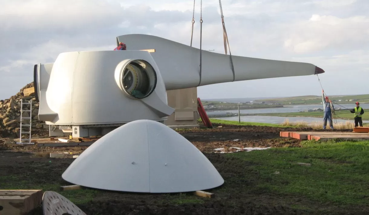 Workers constructing a turbine
