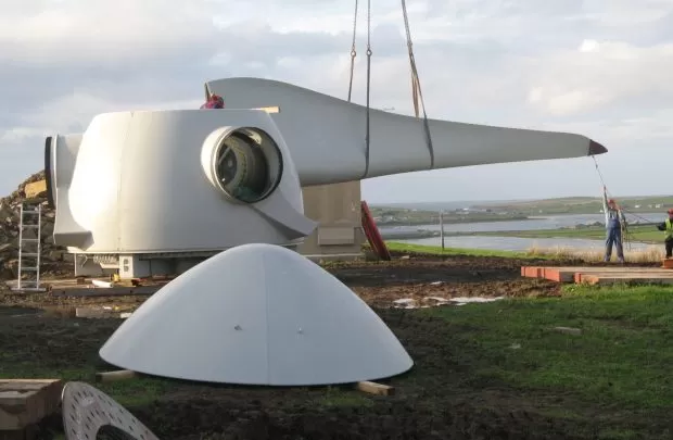 Workers constructing a turbine
